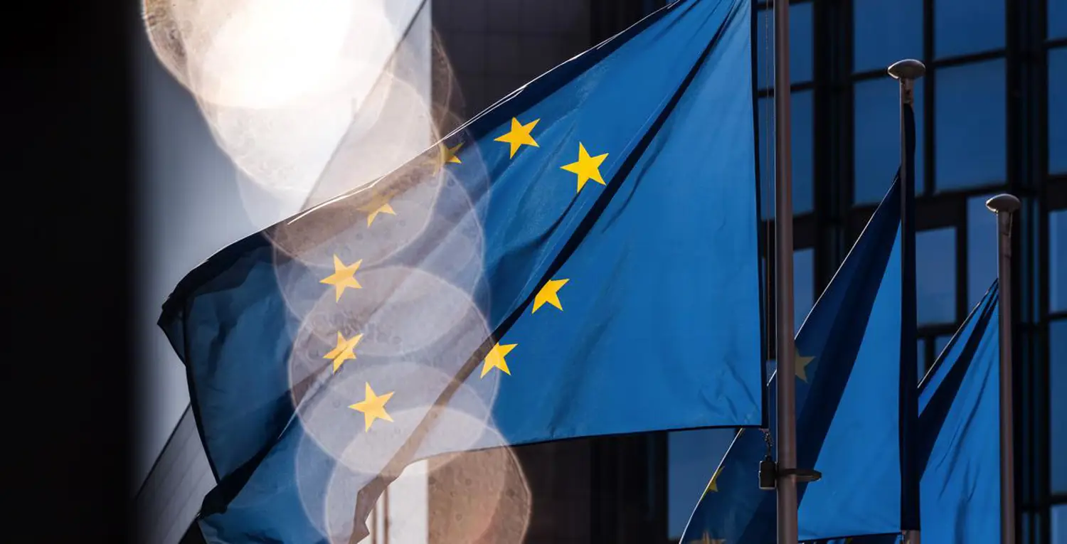 Sunlight falls across European Union (EU) flags in Brussels. Photographer: Geert Vanden Wijngaert/Bloomberg