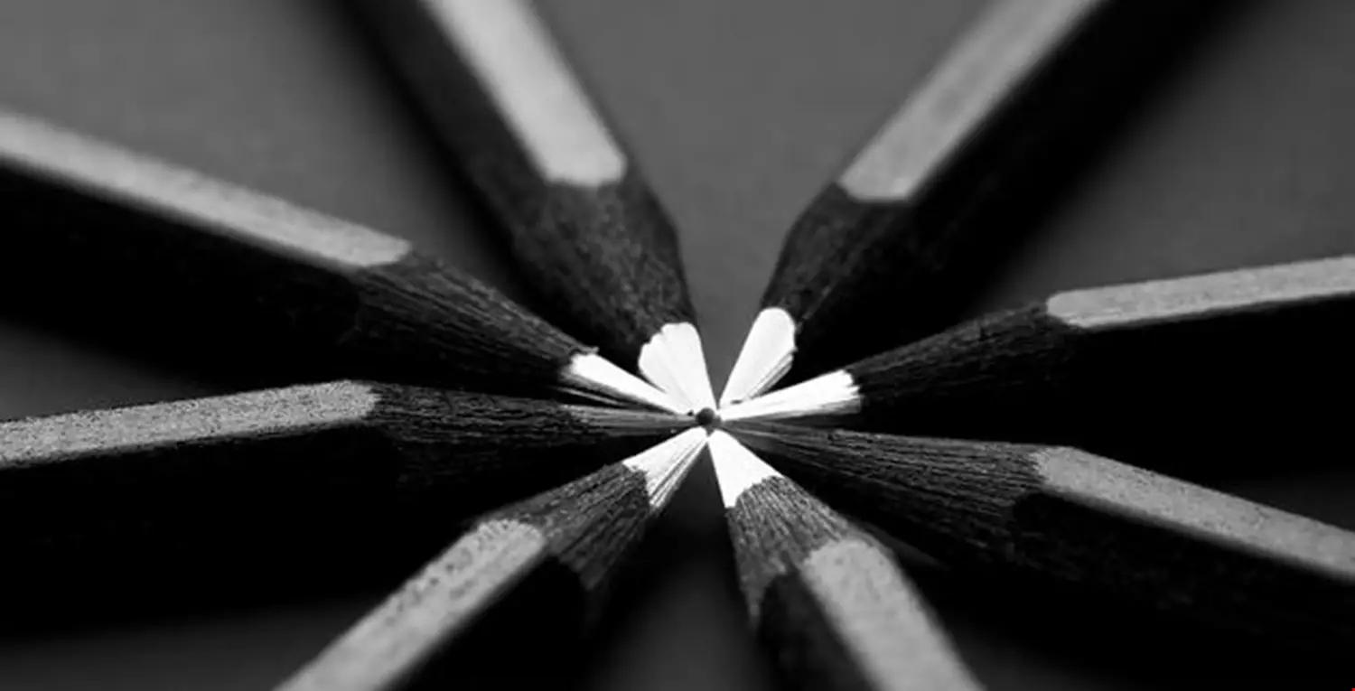 White and black colored pencils. stylish business concept, on black background